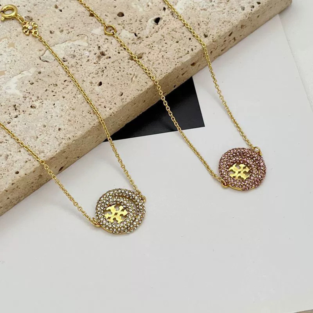 Tory Burch Gold Plated Copper Double Ring Bracelet with Geometric Pave Diamonds
